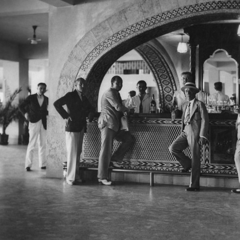The bar of the Havana Jockey Club, which was American owned and managed. Said Abbe: "The visiting American can (and does) perform two perfectly legal operations at once, which are both against the law in his native land: bet on the races and imbibe alcoholic beverages." © James Abbe Archive 2021